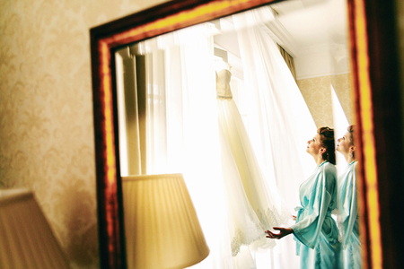 The bride looking at her dressの写真素材