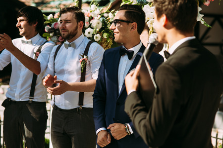 Groom and his groomsmen on the wedding ceremonyの写真素材