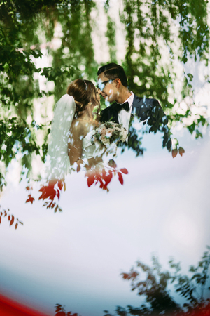 Reflection of the couple in the sunny dayの写真素材