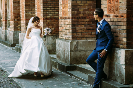 Beautiful bride is walking to her manの写真素材