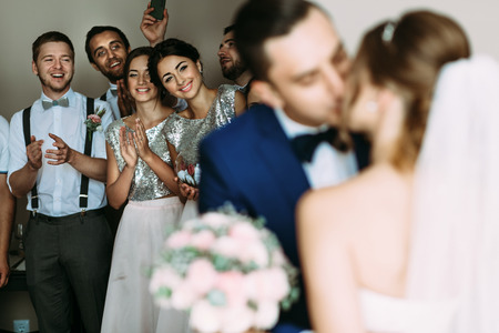 First kiss of the couple in the wedding dayの写真素材