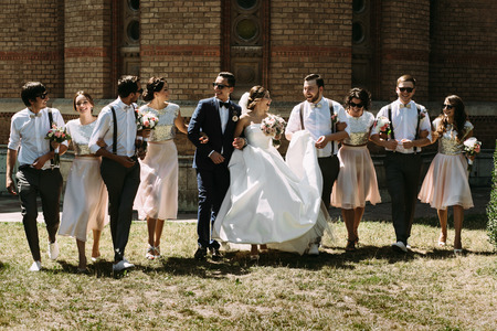 Joyful young couple and their stylish friendsの写真素材