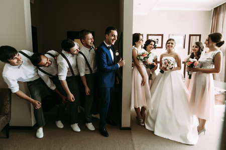 Emotional photo of the couple and their crazy friendsの写真素材