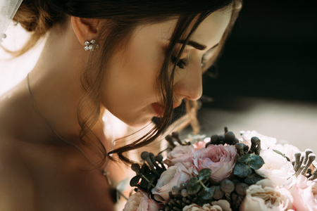 Sensual photo of the bride with a bouquetの写真素材