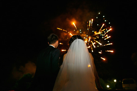 Couple in love look at fireworksの写真素材