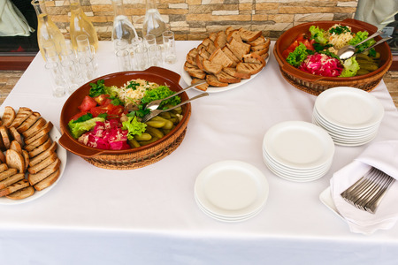 Plates with pickled cucumbers and tomatoesの写真素材