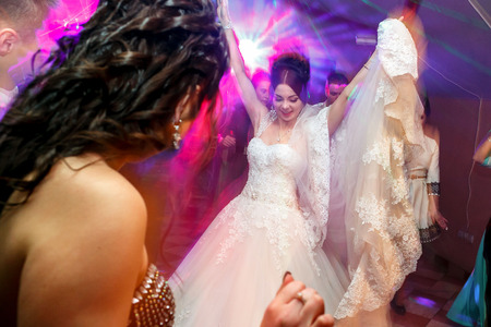 The bride with guests dancing on the dancefloorの写真素材