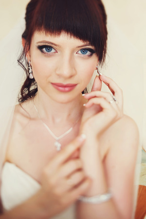 Blu-eyed eye adjust an earring with white crystalの写真素材