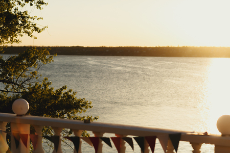A view from the balcony on the sunset over a seaの写真素材