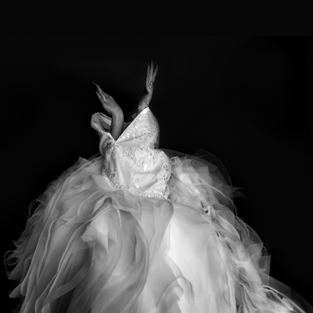 Bride looks like a bird putting a wedding dressの写真素材