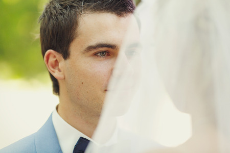 Sincere glance of the groom on the wedding ceremonyの写真素材