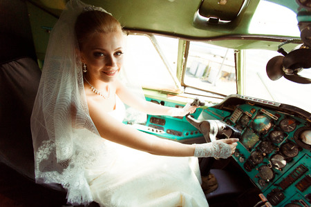 Charming bride in the cabin of the planeの写真素材