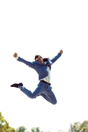 Groom is jumping from the happiness