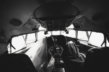 Romantic couple in the cabin of the planeの写真素材