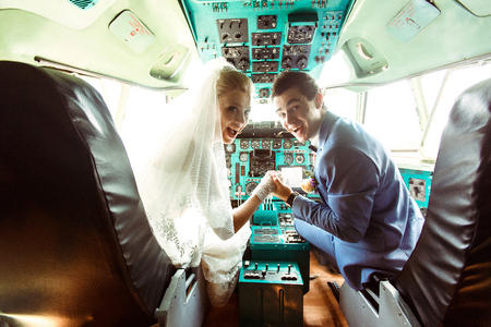 Crazy couple in the cabin of the planeの写真素材