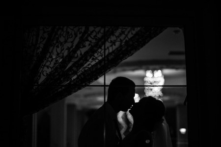 The brides stands near windowの写真素材