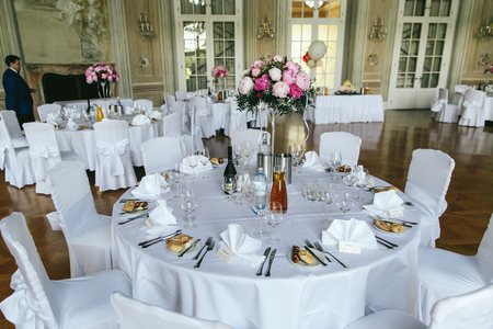 Look from above at the white dinner table festive served for a dinnerのeditorial素材