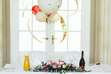 White table served for newlyweds and decorated with pink peoniesの写真素材