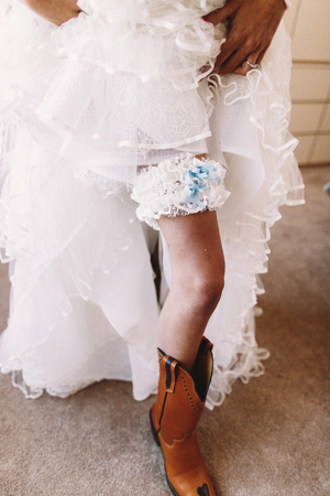 White lace garter put over woman's legの写真素材