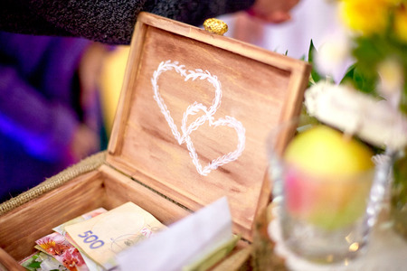 Wedding decor. Wooden chest with printed white heartsの写真素材