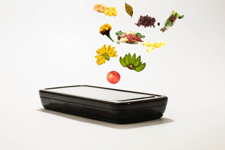Mobile phone and food,fruit,vitamin,vegetablesの写真素材