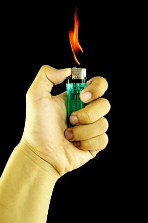 Cigarette lighter in handの写真素材