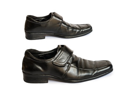 Secondhand leather shoe on isolate white backgroundの写真素材