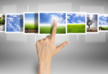 hand select image on digital technology screenの写真素材