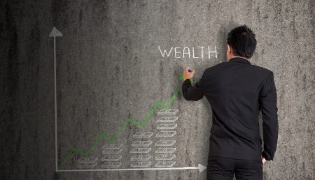 businessman drawing graph and  concept  on old wallの写真素材