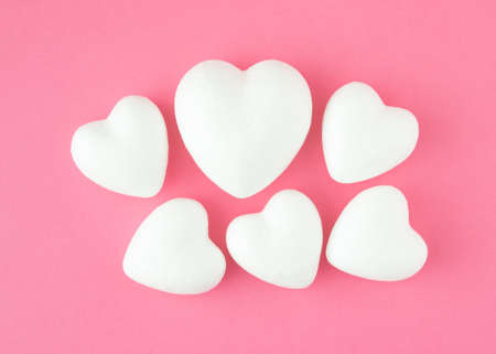 White hearts on pink backgroinds. Minimalistic concept of Valentines day.の写真素材