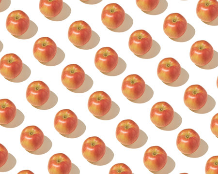 Pattern arranged from fresh, organic, red apples on a white backgroundの写真素材