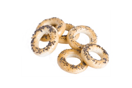 Round cracknels with poppy seeds over white の写真素材
