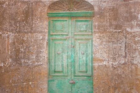 Retro wallpaper with a vintage green door の写真素材