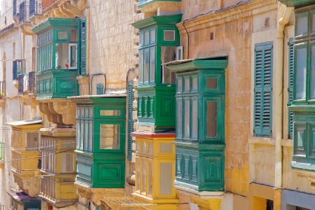 Green retro balconies on a wall of a Mediterranean houseの写真素材