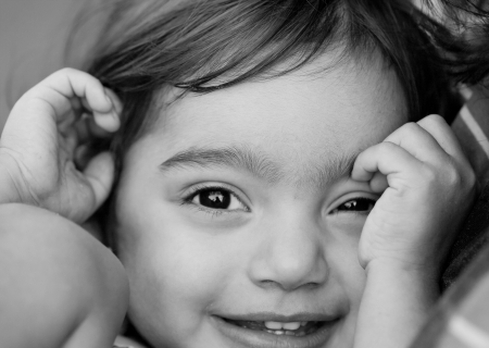 Extreme closeup black and white portrait of a playful happy childの写真素材