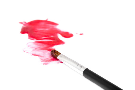 Lip gloss with brush over white background with shadowの写真素材