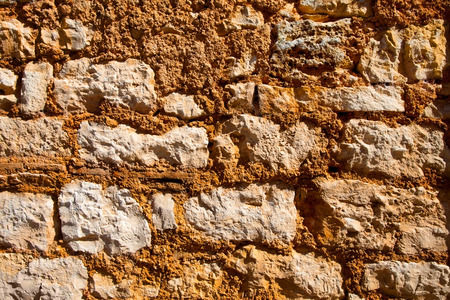 Old wall texture with large rocks and binding mixture