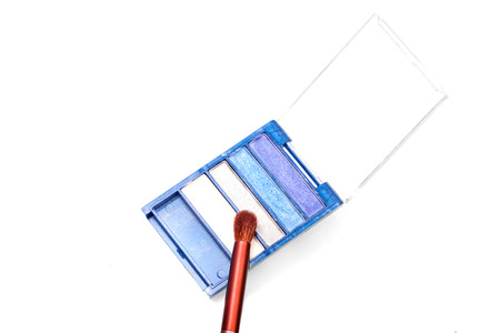 Blue range eyeshadows with a brush isolated on whiteの写真素材