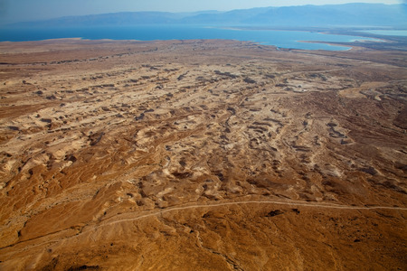 Desert landscape at the shore of Dead Sea (view to Jordan mountains on sunset)の写真素材