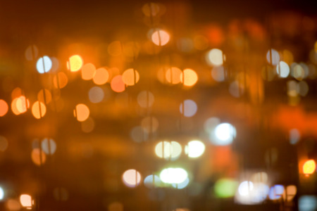 Abstract blurred bokeh background with warm orange lights (blurred)の写真素材