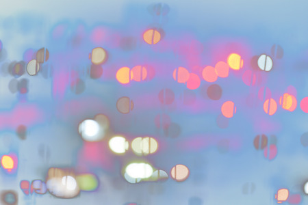 Abstract irregular blue blurred background with pink bokeh globes (blurred)の写真素材