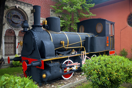 Vintage steam locomotive mounted in a park as a decorationの写真素材