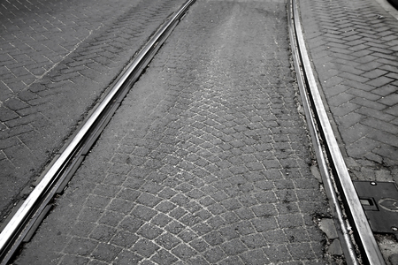 Old tramway railway on cobblestone streetの写真素材