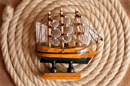 Aged Rope and ship on the old paper backgroundの写真素材