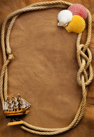 Aged Rope and ship on the old paper backgroundの写真素材