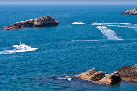 open sea under solid blue sky with lots of copyspaceの写真素材