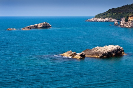 open sea under solid blue sky with lots of copyspaceの写真素材