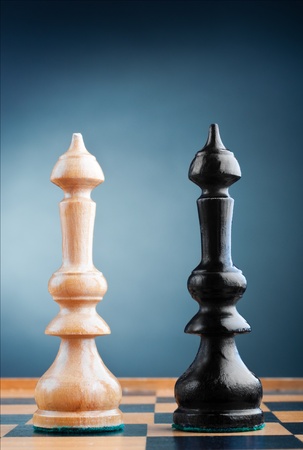 two chess kings on the chessboard, blue backgroundの写真素材