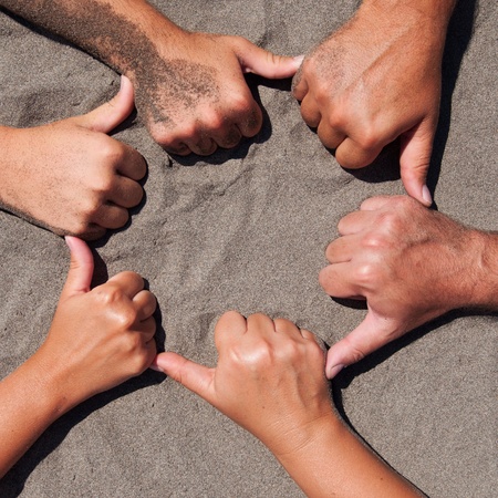 Image of  hands on sand - circle formの写真素材