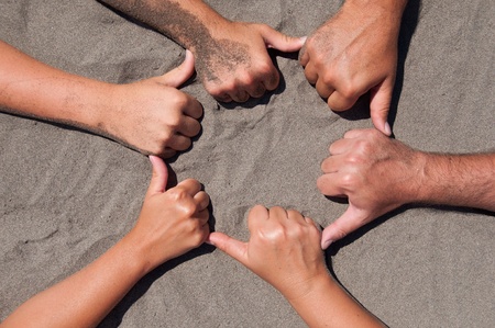 Image of  hands on sand - circle formの写真素材